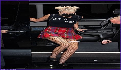 Miley Cyrus grabs attention in tartan mini skirt and fishnets with garter after SNL rehearsals in NY